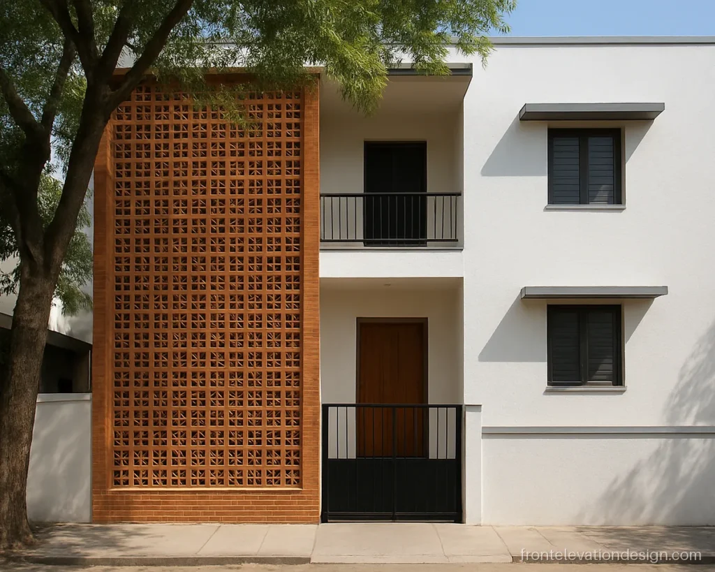 G+2 front elevation with a terracotta jali over the staircase and white walls